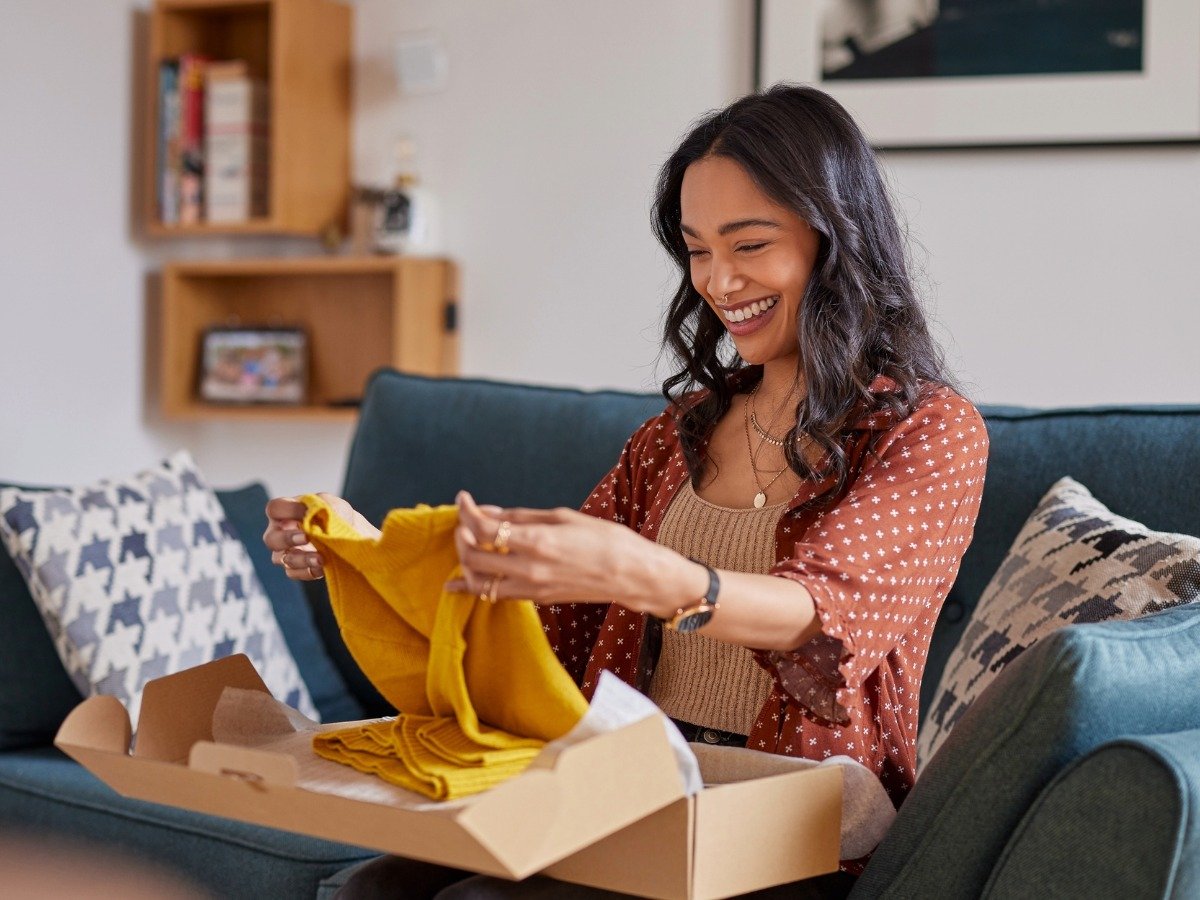 Happy customer with an online order product delivery.